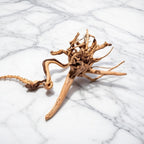 Driftwood piece on a marble surface