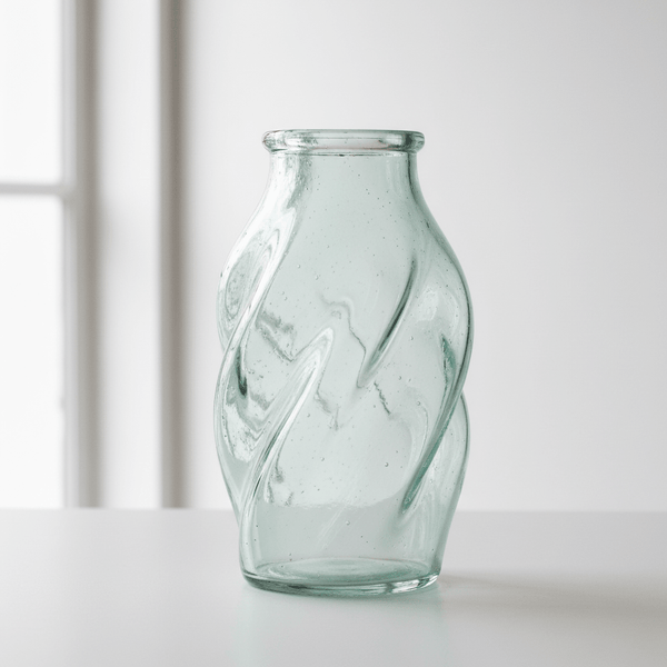 A one-of-a-kind glass container selected for unique shape, character, or age.