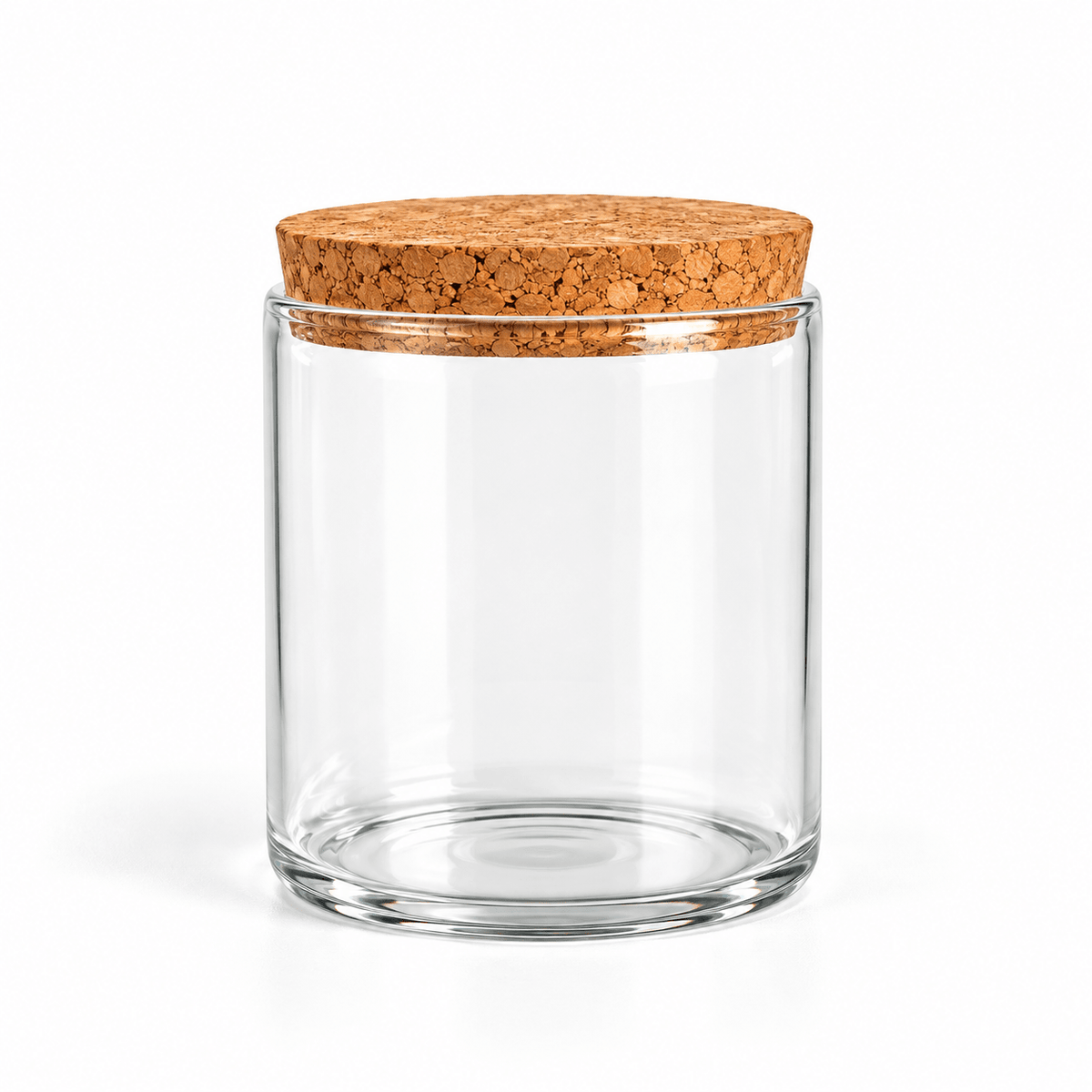 A clear glass jar with a round cork lid, shown on a clean white background.
