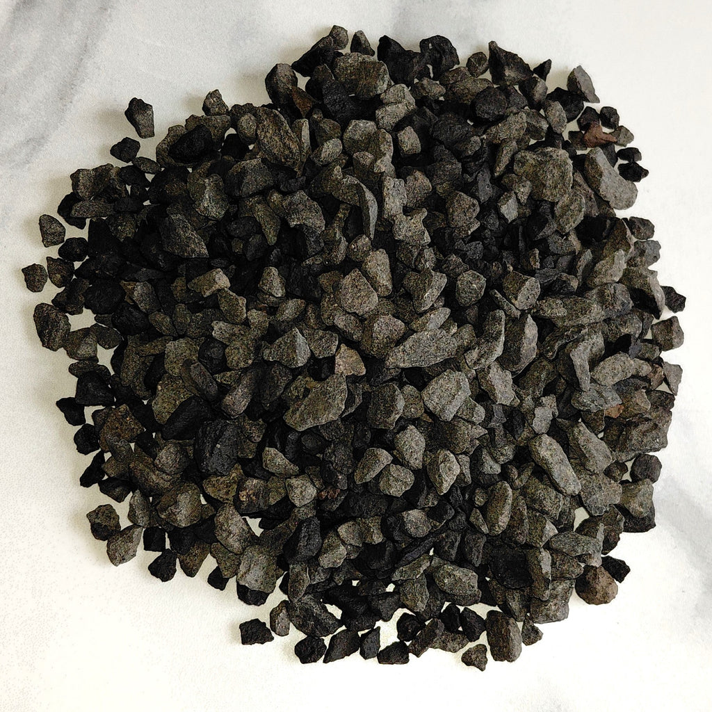Basalt pebbles on a marble surface for terrariums