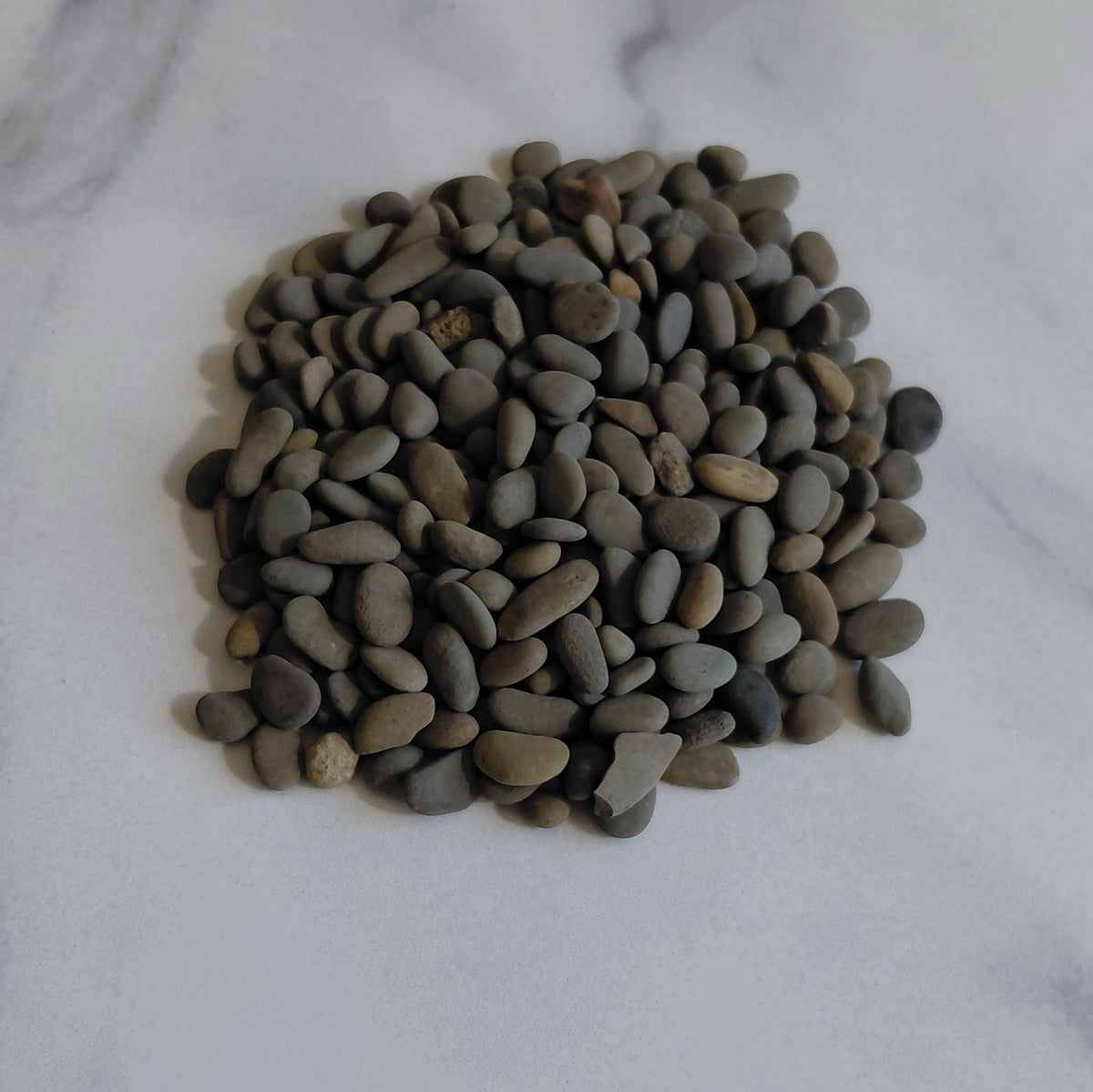 Small pile of stones on a marble surface