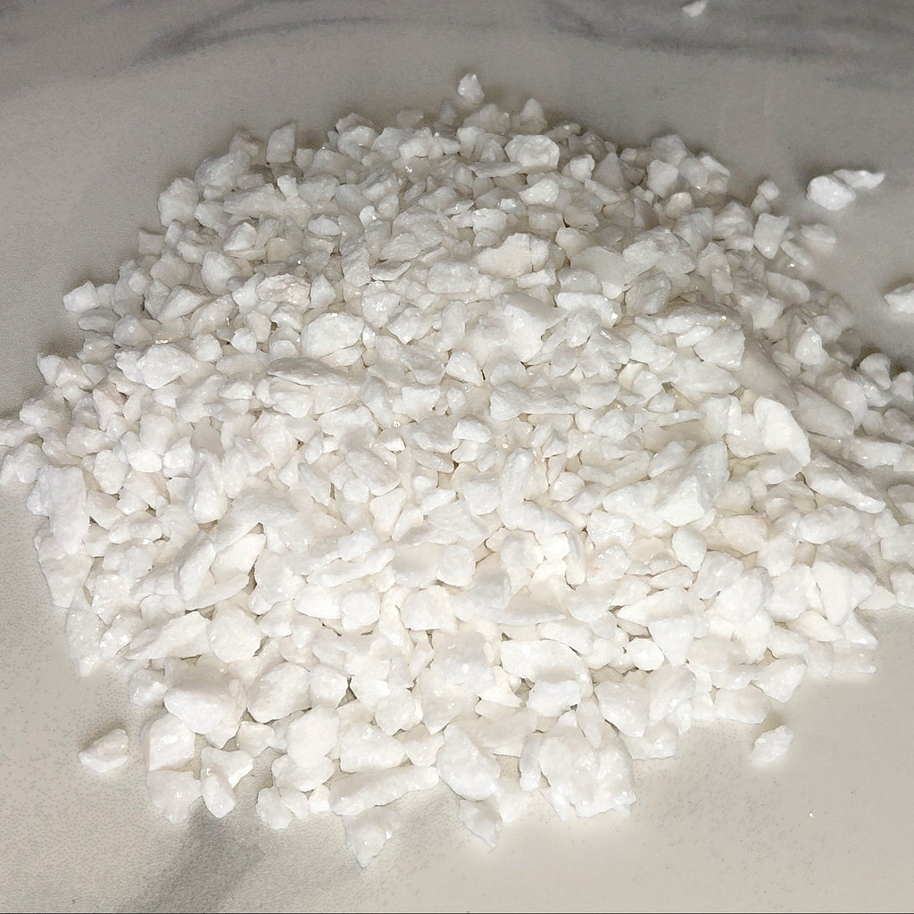 White granular material on a marble surface for terrariums