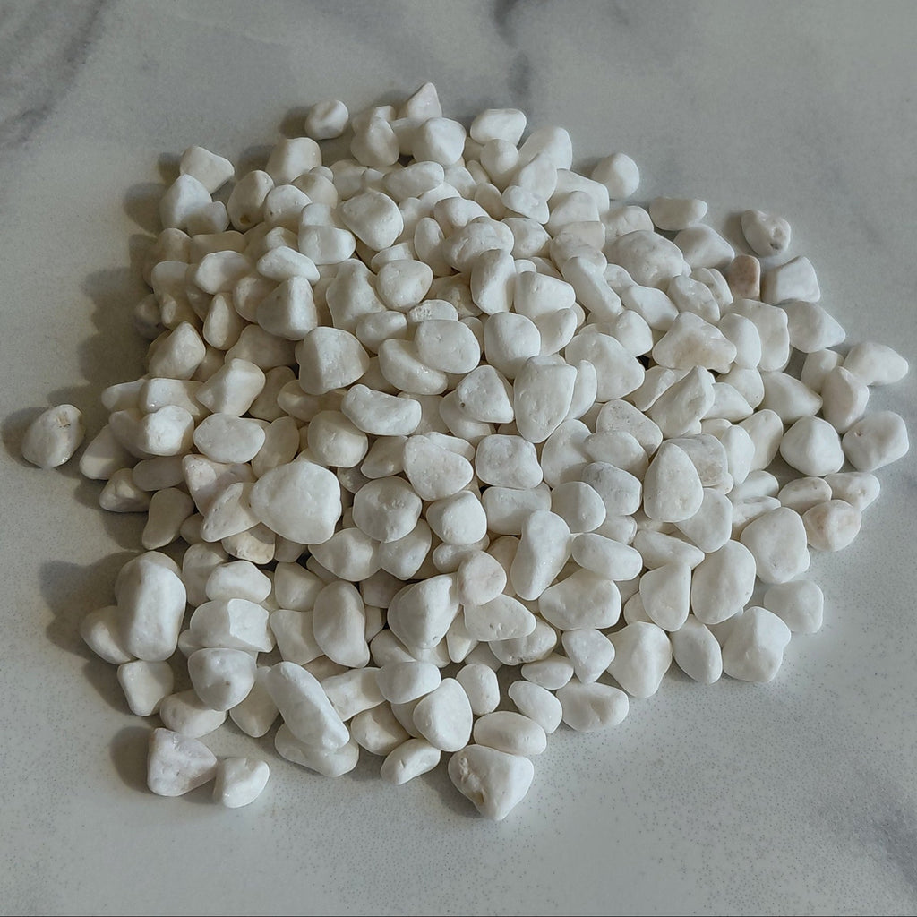 White pebbles on a marble surface