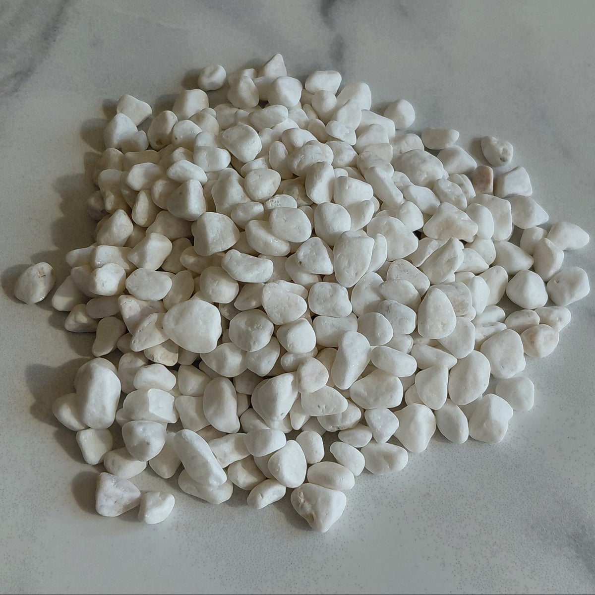 White pebbles on a marble surface